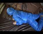 Jill putting on a sexy blue shiny nylon down suit and lolling on bed (Pics)