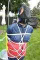 Watch Sandra beeing bound, pantygagged and finally pantyhooded in her shiny nylon Rainwear