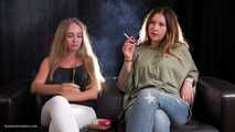 Two friends are smoking sitting on the sofa in this smoking fetish video