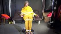 Sandra being tied and gagged on a hairdresser´s chair wearing sexy yellow shiny nylon rainwear being double hooded (Video)