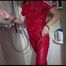 Sonja tied and gagged in a shower cabine with cuffs wearing a supersexy red shiny nylon jumpsuit (Video)