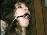 ERICA IS RING GAGGED, MOUTH STUFFED, CLEAVE GAGGED & TIED WITH BLACK NYLON ROPE (D36-10)