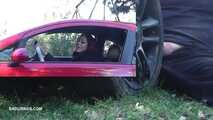 Mistress Cleo smokes and smashes balls with a car CBT A picture in a picture version