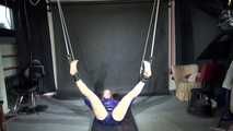 Watching Pia wearing a supersexy shiny nylon shorts lying on the floor being tied and gagged with ropes and a ballgag on the ceiling (Videos)