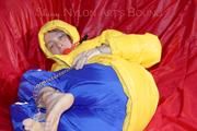 Sonja tied, gagged and hooded on a sofa wearing a sexy blue rain pants and a yellow downwear jacket (Pics)