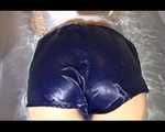 Watching Sandra wearing a sexy blue shiny nylon shorts and a top while playing with water in her bath tub (Video)