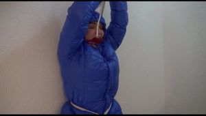Jill tied, gagged and hooded in a stairway with cuffs wearing a sexy blue PAMY jacket and a rain pants (Video)