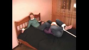 Catt and Alexa - Naughty girl tied up before joining helpless girlfriend on the bed (video)