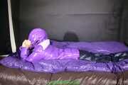 Watch Maly enjoying her shiny nylon Downjacket in her shiny nylon Bed