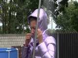 Watch Sandra taking a shower in her new purple shiny nylon down jacket 