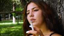 Good smoker Elmira is chain smoking all white 120mm cigarettes