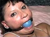 33 YEAR OLD AMERICAN INDIAN TRISH IS BALL GAGGED, MOUTH STUFFED, OTM  GAGGED, BAREFOOT, & TIED UP TIGHT WITH ROPE (D64-14)