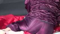 Sexy PIA wearing a sexy purple shiny nylon downbib lolling on the sofa (Video)
