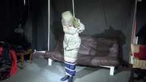 Sexy Sandra being tied and gagged and hooded with ropes and a ballgag overhead wearing sexy rainwear and rubber boots  (Video)