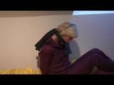 02:45 Min. video with Pia tied and gagged in a shiny nylon rainsuit