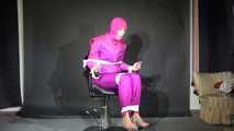 Sexy Pia tied and gagged with ropes and a clothgag on a hairdresser´s chair wearing a sexy pink shiny nylon downsuit (Video)