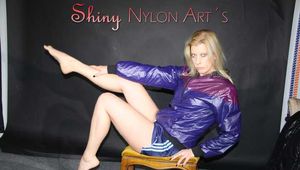 Watching sexy Pia in a sexy oldschool blue shiny nylon shorts and a special rain jacket posing for you on a little chair (Pics)