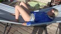 SEXY Sonja wearing sexy shiny nylon shorts enjoying the sun and the shorts in a hammock (Video)