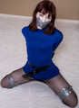 Kitty Quinzell in blue dress and silver tape
