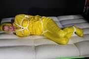 Get Pictures of Pia bound and gagged in her yellow shiny nylon Rainwear