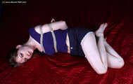 Agnes hogtied on bed