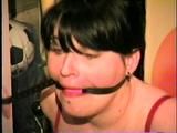 22 YEAR OLD FEISTY DEREK IS MOUTH STUFFED, GAGGED WITH HER OWN WRISTS, TIED TO RACK & BALL-GAGGED IN THE BASEMENT (D58-6)