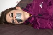 Shelly tied and gagged in a shiny nylon rainauit 