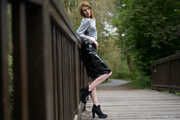 Miss Petra in a hot vinyl skirt, high heels and transparent blouse at photo shooting