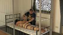 Hogtie with belts in jail