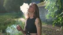 18 y.o. Margarita is smoking three cork 120mm cigarettes outdoors
