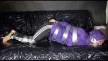 SANDRA tied and gagged with tape on a sofa wearing a sexy black shiny nylon pants and a purple rain jacket (Video)