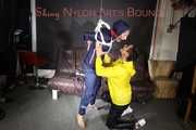 Sandra beeing tied and gagged by Stella in Shiny Nylon Rainwear crotchrope-suspended 