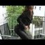 Alina trying on different shiny nylon shorts and rain jackets feeling comfortable on the balcony (Video)