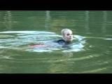 Jenny bathing in a lake and sun bathing wearing sexy red shiny nylon shorts and a rain jacket (Video)