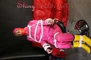 Watching sexy PIA wearing several layers of rainwear being tied on a hair cutters chair with ropes and gagged with tape (Pics)