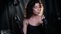 Great smoker Anastasia is smoking two all white cigarettes in a leather  gloves