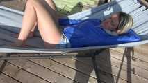 SEXY Sonja wearing sexy shiny nylon shorts enjoying the sun and the shorts in a hammock (Video)