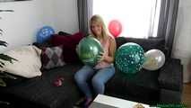 sitpopping promotional balloons on the couch