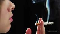 A young lady showing her smoking skills in a closeup video 