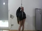 Katharinna tied, gagged and crotchroped on the ceiling wearing a sexy black shiny nylon shorts and a shiny black rain jacket (Video) 