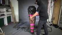 Marie M bound and gagged in shiny nylon Downwear trying to escape