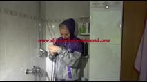 Mara tied, gagged and hooded in a shower wearing a sexy purple rain combination (Video)