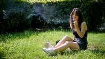 Arina is smoking 120mm cigarettes outdoors