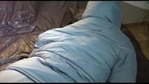 Jill ties, gagges and hoodes herself on a bed wearing supersexy grey shiny nylon downwear (Video)