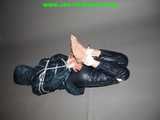 Get 101 Pictures with Lupi tied and gagged in shiny nylon rainwear from 2005-2008!