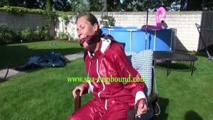 Watch Sandra bound, gagged and nylonhooded in her shiny nylon Rainwear