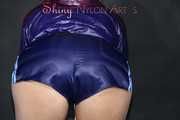 Watching sexy Pia in a sexy oldschool blue shiny nylon shorts and a special rain jacket posing for you on a little chair (Pics)