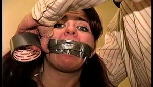 23 YR OLD REAL ESTATE BROKER IS MOUTH STUFFED WITH A SPONGE, WRAP TAPE GAGGED, GAG TALKING, RAG STUFFED IN MOUTH AND TIGHTLY HANDGAGGED  (D74-15)