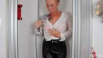 Blonde Frida takes a shower in her white shirt and black glossy pants