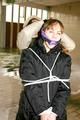 Blond-haired archive girl tied and gagged by another archive girl wearing shiny down jackets (Pics)